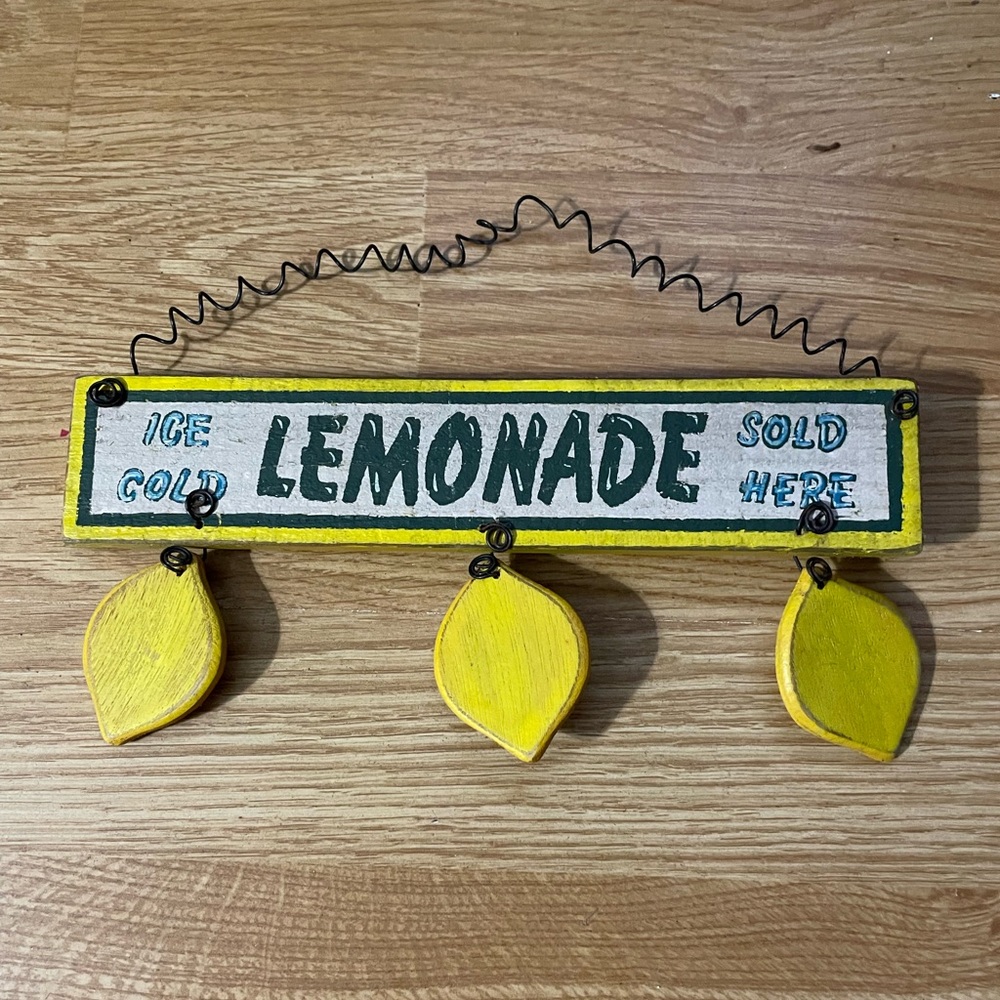 Sign says; LEMONADE ICE COLD SOLD HERE
